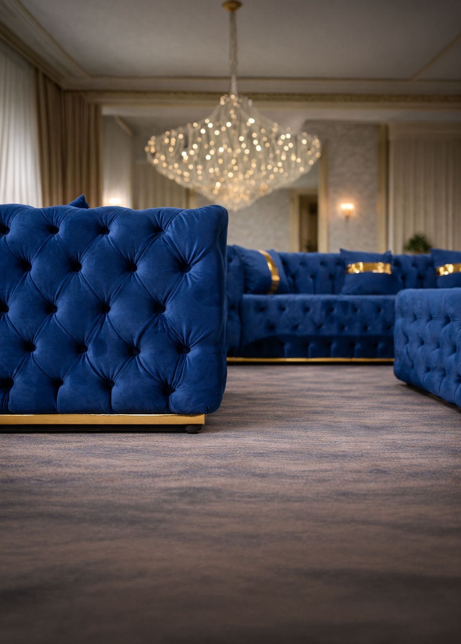 California velvet-upholstered sofa by IMPACT MOB, featuring a sleek design and plush cushions in a stylish living room setting.